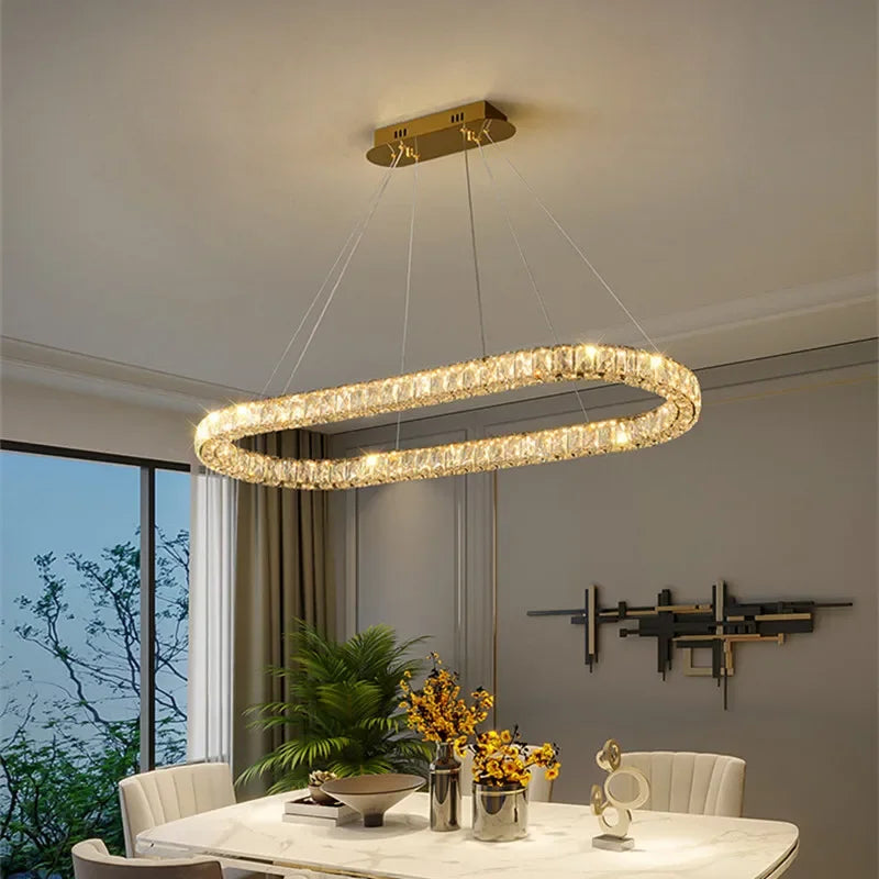 Afralia™ Oval Crystal LED Pendant Light for Luxury Dining Room
