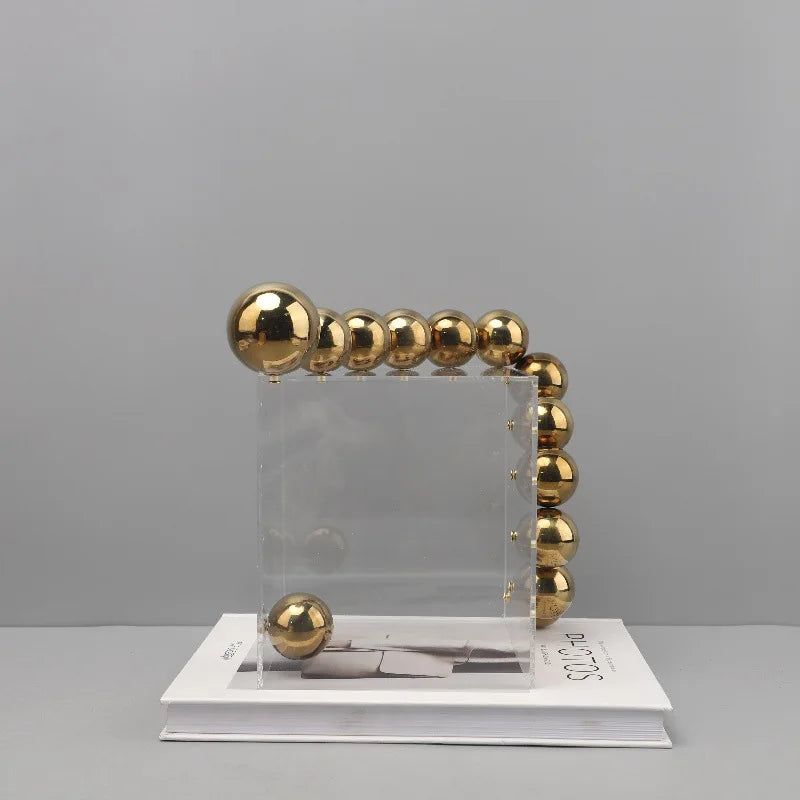 Afralia™ Geometric Sculpture: Clear Acrylic Cube with Golden Ball, Metal Cover; Home Decoration Accessory