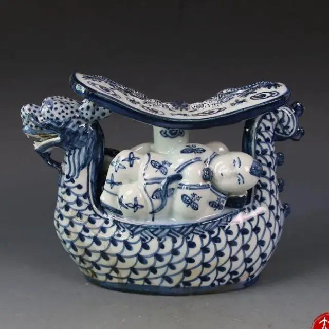 Afralia™ Blue White Porcelain Child Sleep Dragon Boat Statue
