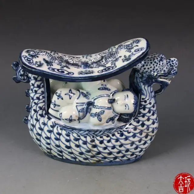 Afralia™ Blue White Porcelain Child Sleep Dragon Boat Statue