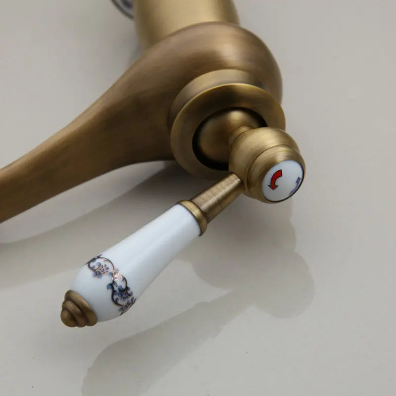 Afralia™ Antique Brass Bathroom Basin Faucet Deck Mounted Retro Mixer Vanity Taps