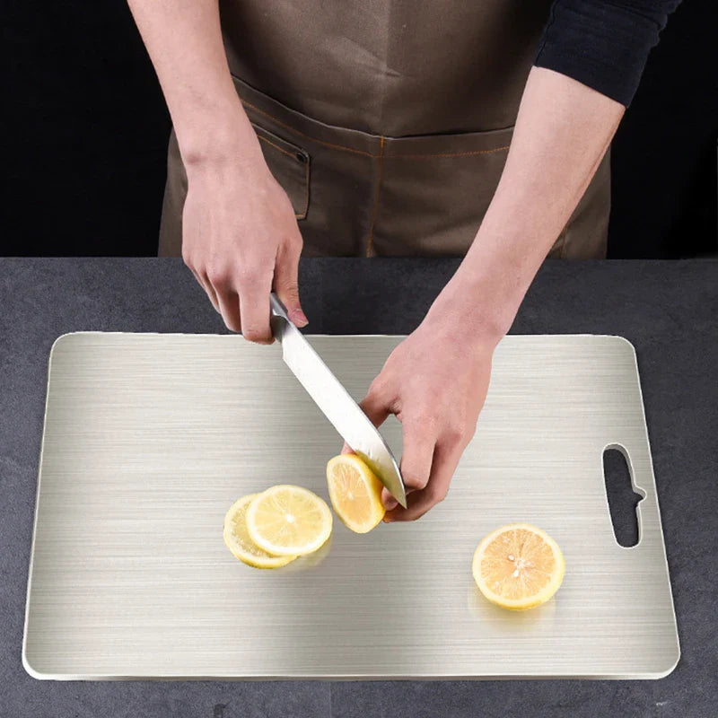 Afralia™ Stainless Steel Chopping Block Cutting Board effective for fruits, vegetables, and meat.