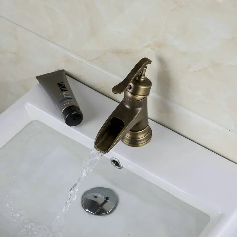 Afralia™ Antique Brass Waterfall Basin Faucet with Art Design Handle