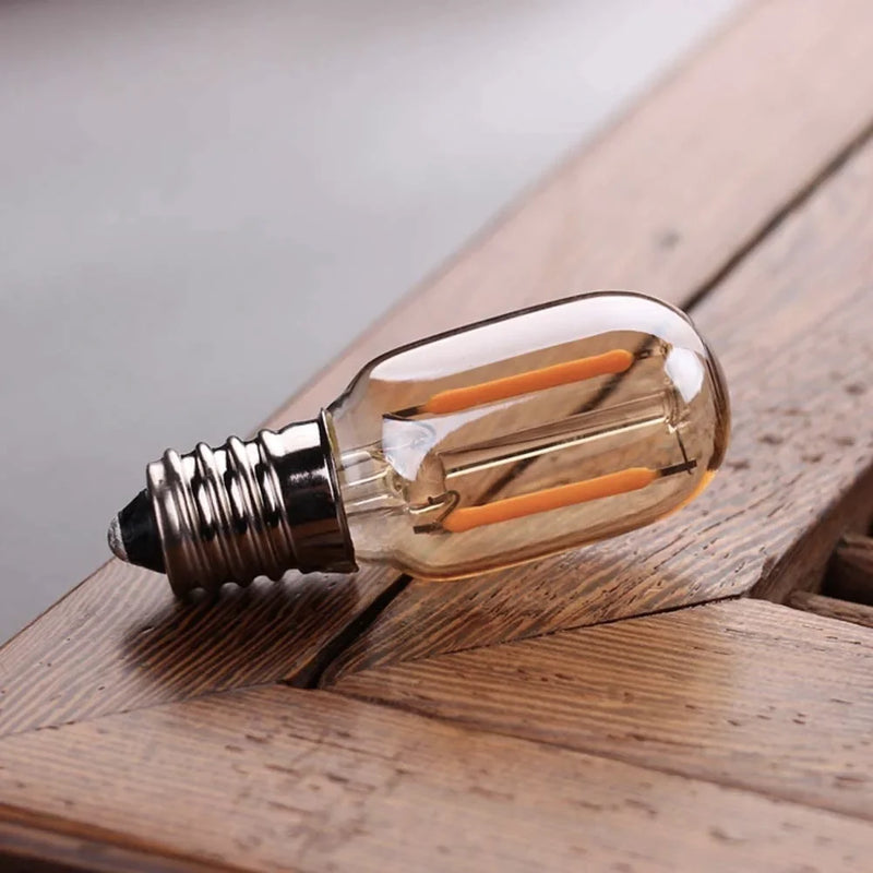 Afralia™ Amber Glass Dimmable LED Filament Bulb E12 E14 Base T22G 1W 2200K