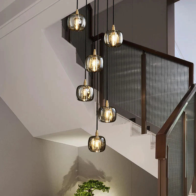 Afralia™ Copper Rotating Staircase Pendant Lamp with Double Hollow Design