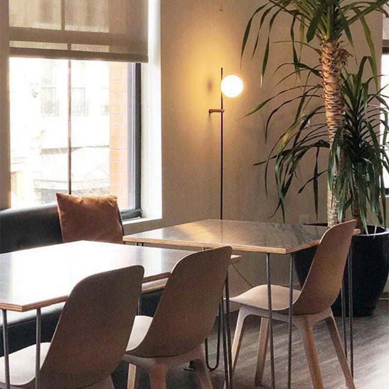 Afralia™ Nordic Vintage Black Iron Ball Wall Lamp with Long Arm E14 Bulb