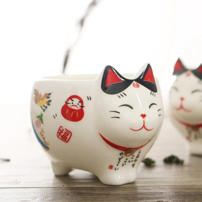 Afralia™ Lucky Cat Porcelain Tea Set: Maneki Neko Tea Cup Pot, Strainer, Plutus Cat Teapot Mug