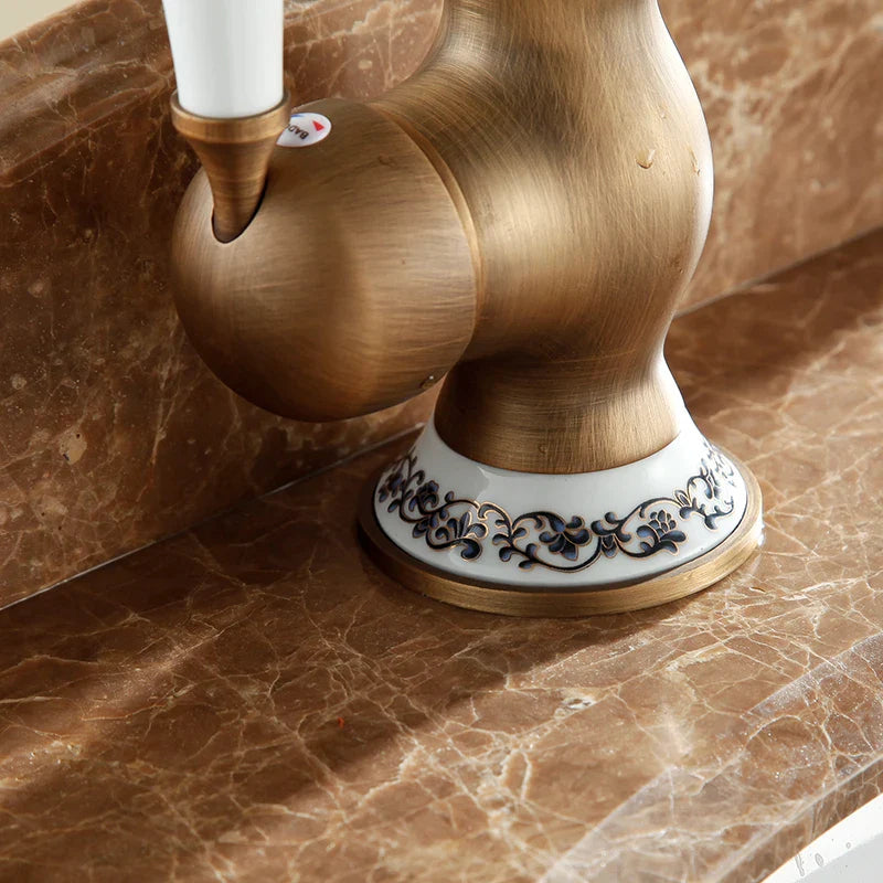 Afralia™ Antique Brass Bathroom Sink Faucet Single Handle Swivel Spout Hot Cold Mixer