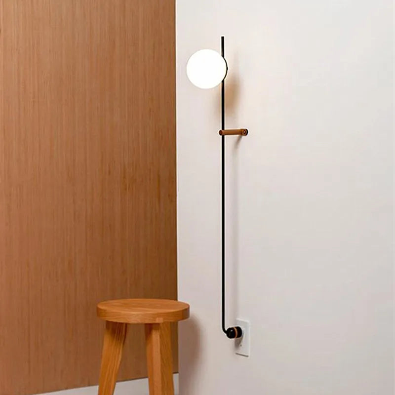 Afralia™ Nordic Vintage Black Iron Ball Wall Lamp with Long Arm E14 Bulb