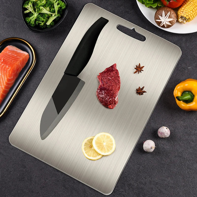 Afralia™ Stainless Steel Chopping Block Cutting Board effective for fruits, vegetables, and meat.