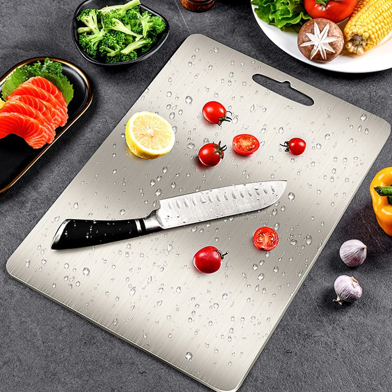 Afralia™ Stainless Steel Chopping Block Cutting Board effective for fruits, vegetables, and meat.