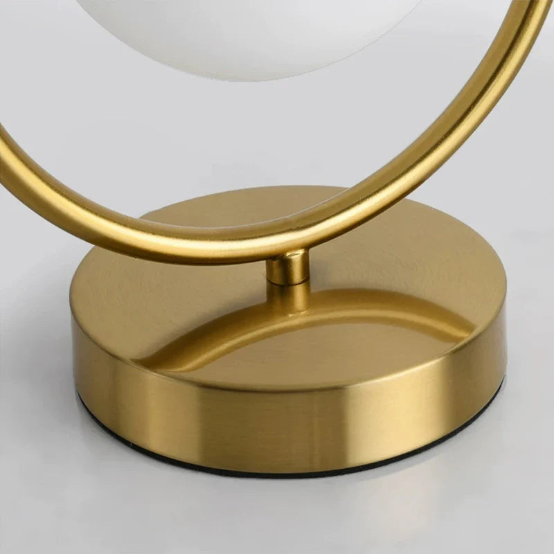 Afralia™ Nordic Brass Ring Glass Ball LED Table Lamp for Modern Living Room & Bedroom