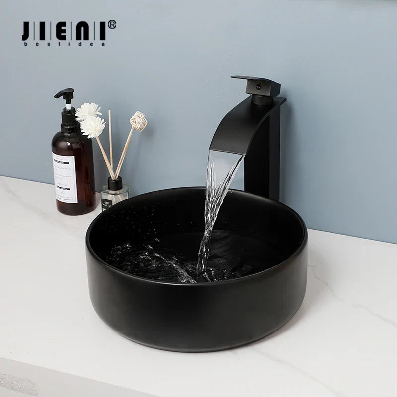 Afralia™ Matte Black Ceramic Basin Faucet Set with Waterfall Outlet and Drainer