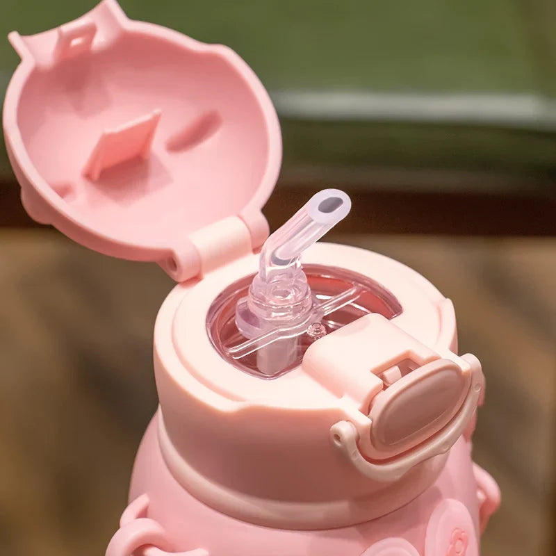 Afralia™ Kids Cute Cartoon Water Cup with Portable Strap - BPA-Free Student Sippy Cup