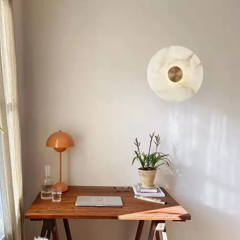 Afralia™ LED Marble Brass Wall Sconce: Modern Art Deco Round Light for Parlor & Aisle