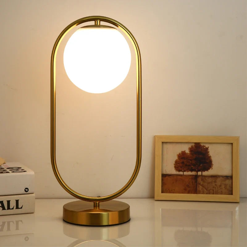 Afralia™ Nordic Brass Ring Glass Ball LED Table Lamp for Modern Living Room & Bedroom
