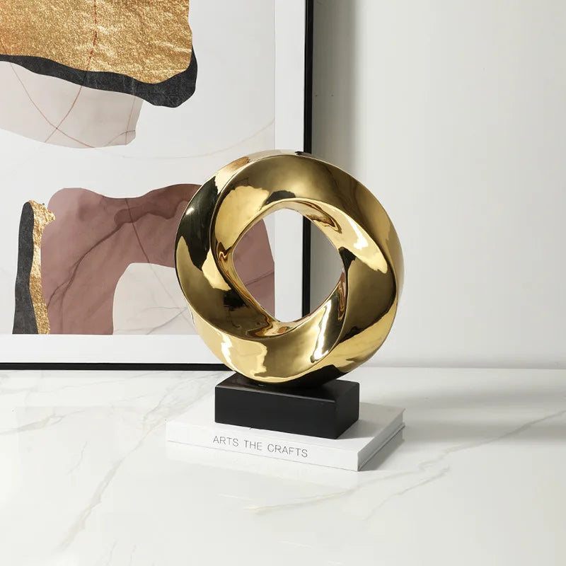Afralia™ Geometric Gold Hollowed Twisted Circles Figurines Home Decor