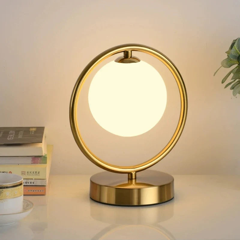 Afralia™ Nordic Brass Ring Glass Ball LED Table Lamp for Modern Living Room & Bedroom