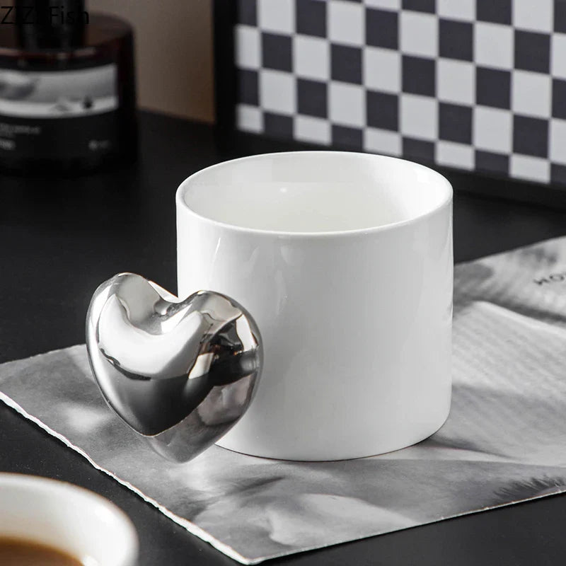Afralia™ Silver Heart Handle Mug - Ceramic Coffee Cup for Dining Table or Afternoon Tea