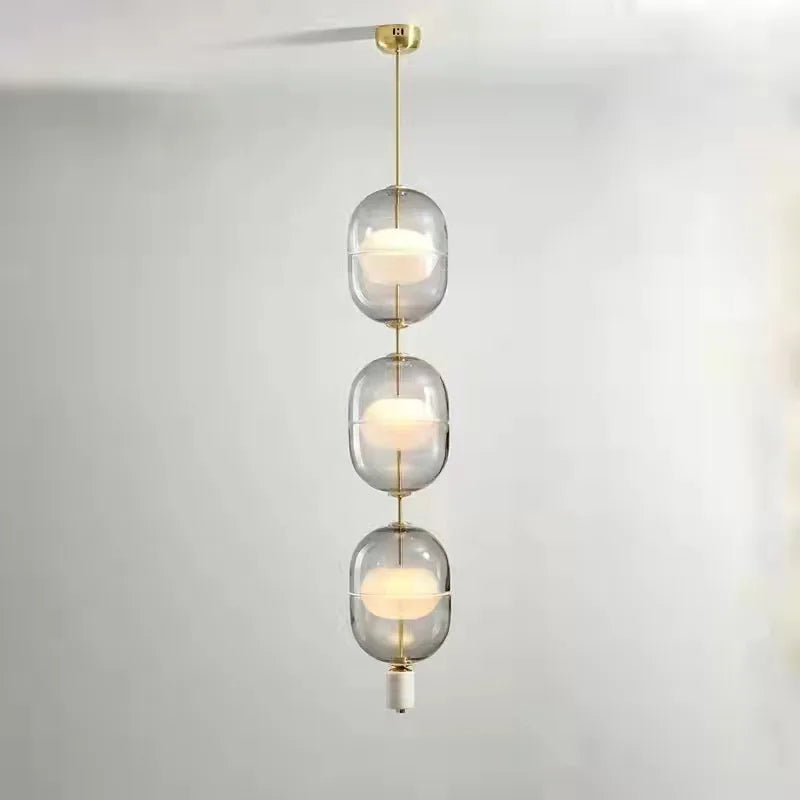 Afralia™ Clear Gray Amber Glass Pendant Light with Marble Gold Metal Finish