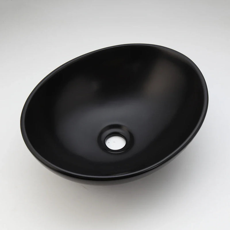 Afralia™ Matte Black Ceramic Oval Bathroom Bowl Sink with Brass Faucet Mixer Tap