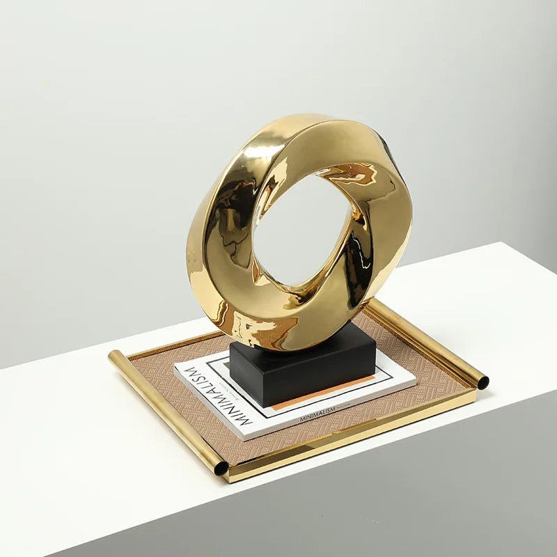 Afralia™ Geometric Gold Hollowed Twisted Circles Figurines Home Decor