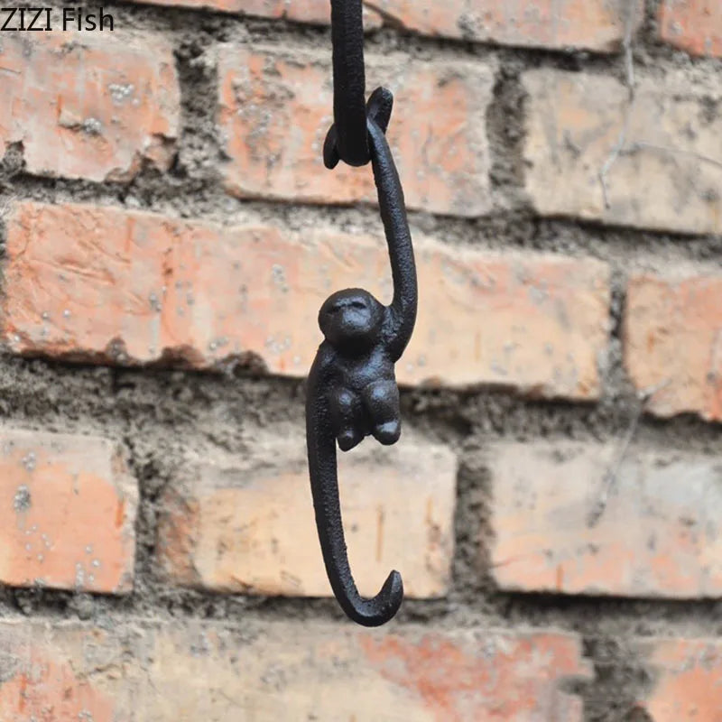 Afralia™ Monkey S Shape Hook Shelf: Cast Iron Decorative Coat Rack for Pastoral Outdoor Decor