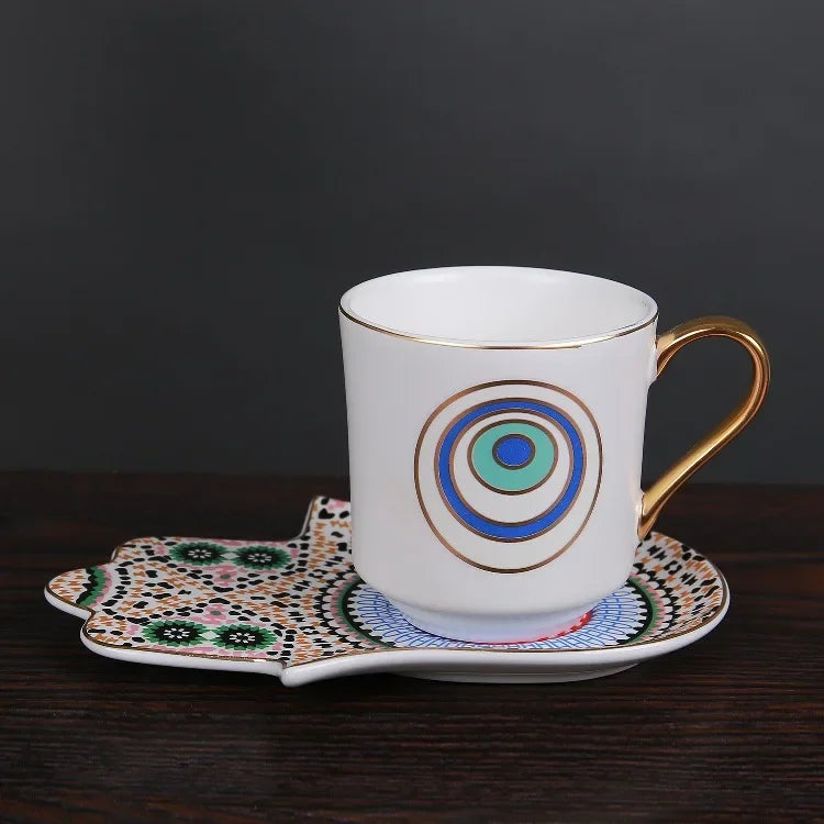 Afralia™ Mystical Gold Gilded Porcelain Coffee Cup & Saucer Set