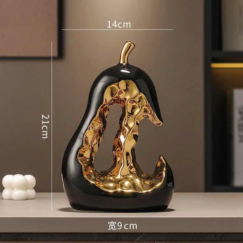 Afralia™ Ceramic Golden Pear Sculpture - Abstract Hollow Fruit Decor for Home Accessories