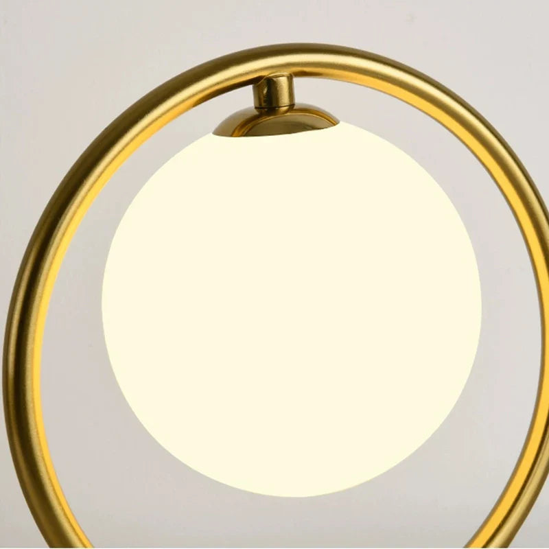 Afralia™ LED Brass Glass Table Lamp for Bedside Reading Desk - Modern Round Ring Design