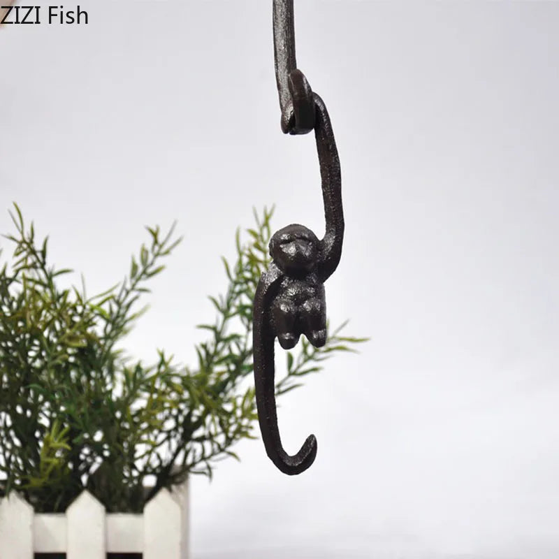 Afralia™ Monkey S Shape Hook Shelf: Cast Iron Decorative Coat Rack for Pastoral Outdoor Decor