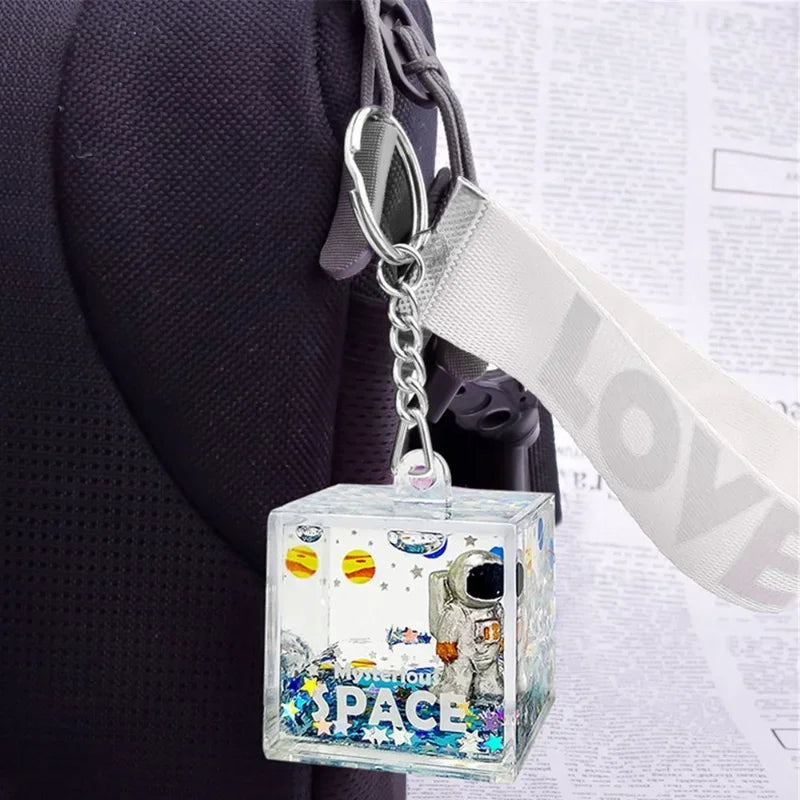 Afralia™ Astronaut Drift Keychain: Creative Liquid Hourglass Stress Relief Toy & Home Decor