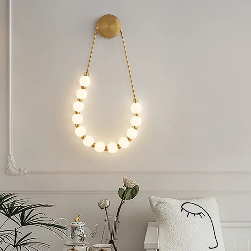 Afralia™ LED Necklace Wall Lights: Gold Black Metal White Acrylic Sconce for Home Art Deco