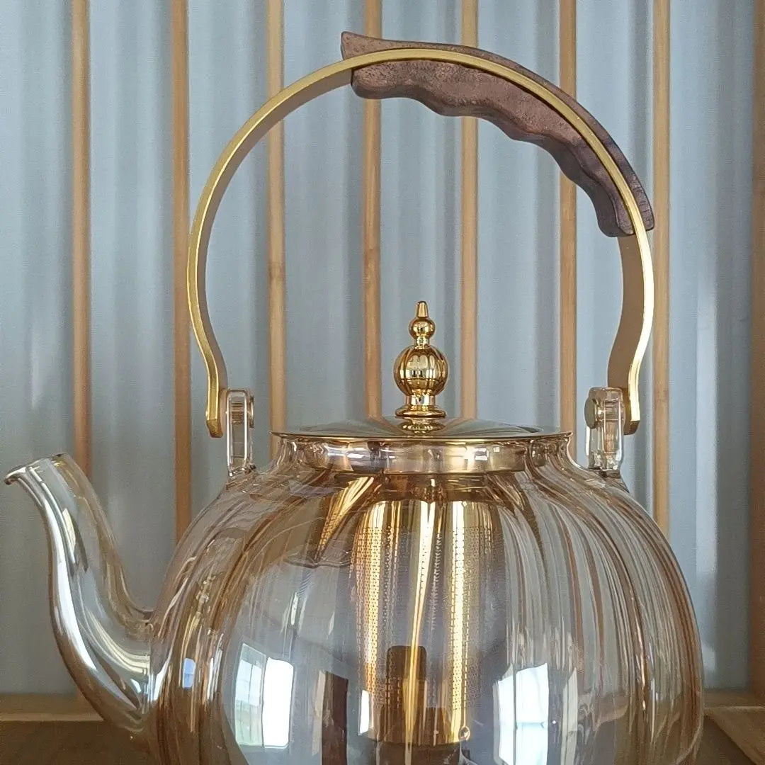 Afralia™ Amber Glass Teapot Filter, Heat-Resistant, Pumpkin-Shaped, Ideal for Boiling and Brewing Tea